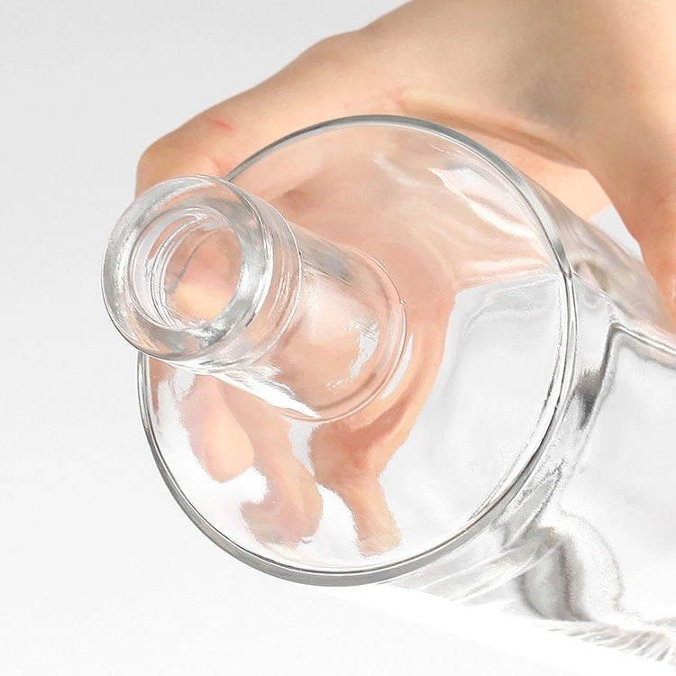 Product Name	large glass wine making bottles Glass Material	Extra White / Super Flint Bottle Shape	Cylinder Shape 750ml Glass Bottle Nominal Capacity	500ml/700ml/750ml/1000ml glass bottle Bottle Weight	650g/680g/750g/800g/850g/1000g Sealing Type	Ropp / GPI / Cork / Guala / Swing Top / Custom Sealing Method Application	Vodka, Whiskey, Rum, Xo Packaging	* 24 pcs / carton, with cardboard separator * 6 pcs / colored box, with cardboard separator * Pallet packaging, with cardboard separator * Carton / box + pallet packaging Decoration	* Decal * Silk Screen Printing * Frosting * Spraying colors * Electropla MOQ	6000pcs for a new run; 1 pcs for stock glass bottles Lead Time	35-45 days Decorations	Printing, Decal, Painting, Electroplating, Frosting These large glass wine making bottles can be used for mineral water, juice, liquor and other beverage. The bottle is strong and durable. It is high heat resistance and anti- impact. Normally the color is transparent and you can also choose your favorite color. You can choose our exist shape or custom the shape. The cap is normal aluminum screw cap or spring cap or cork cap. The surface of the bottle can be bright, matte, frosted and color spray. Custom logo is available. Normally we can print logo by screen printing, embossed, heat stamping, label sticker or customized. FAQ 1.Can we get free samples? Yes. All of our samples are free and customers just need to cover the freight cost. You can do freight collect, or pay the delivery cost to our paypal account. 2. Can we do printing or label printing on the bottles? Yes you can. Various of printing methods are available like silk screen, hot stamping, frost, color sprayer and lable sticker etc. 3. Can you product bottles according to our designs? Yes. We have rich experience in developing custom models due to years of cooperation with big companies. 4. What is the normal Lead Time? A. For stock products, we will send goods to you within 5-10 days after receiving your payment. B. For mass production, lead time is around 35 days, and longer if surface handling is required 5. What is your shipping terms? A. For samples or trial order, EMS, FEDEX, DHL, UPS, TNT can be provided. B. For larger order, we can arrange shipment by sea or air according to your requirements. We will try to help you choose a best way depending different order conditions. 6. How do you control the quality? We have strict QC quality control system, incl. in-process inspection in every process and final inspection. In addtion, we do leak test for 3 times before packing. 7. If any defective and broken bottles, how can you settle it for us? We will replace the defective and broken bottles in your next order or as you required date. 8.Last but the most important: We sincerely hope that we can establish long-term friendly relations of cooperation, more important is that we will become your friends. Thanks for your kindly attention and interested in our glassware! Any inquiries pls feel free to contact us in your earliest convenience.